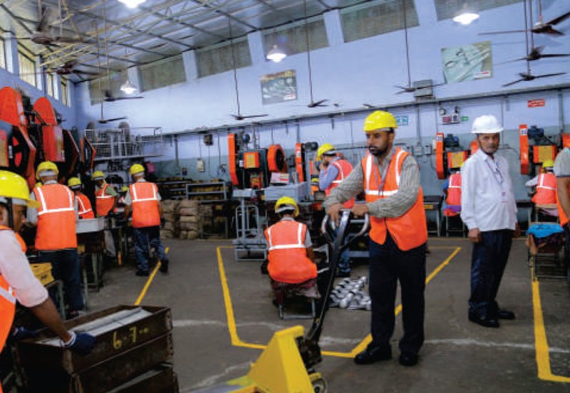 Agam Industries workers on the manufacturing floor